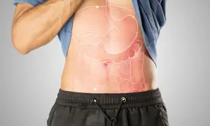 Anatomia jamy brzusznej z zaznaczonymi narządami, w tym żołądkiem i jelitami. Woreczek żółciowy, kluczowy dla trawienia tłuszczów, jest częścią tego układu.