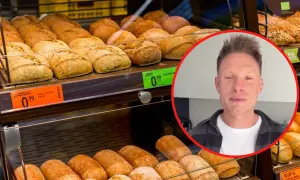 Bułka paryska, biedronka i jej kcal. Mężczyzna w kółku, świeże pieczywo na półce.